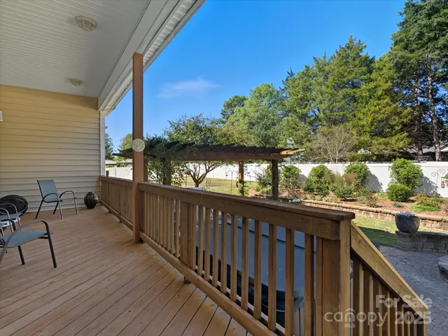 a view of a patio with table and chairs and potted plants