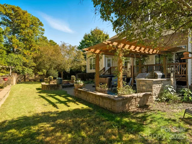 a view of a backyard with swimming pool
