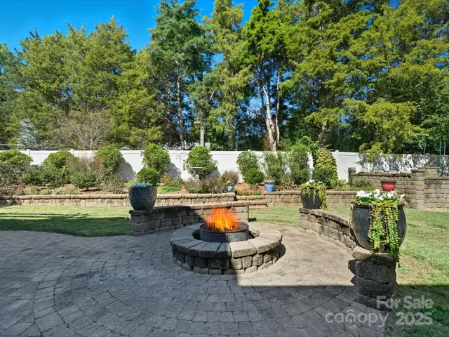 a backyard of a house with outdoor seating