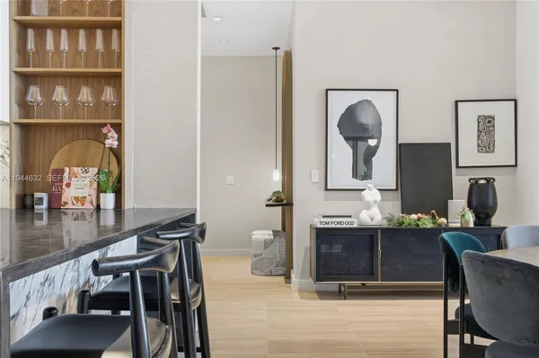 a living room with furniture a lamp and a potted plant