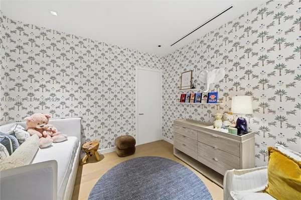 a living room with fireplace furniture and large windows