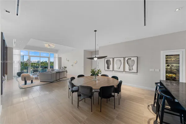 a kitchen with sink cabinets and living room view