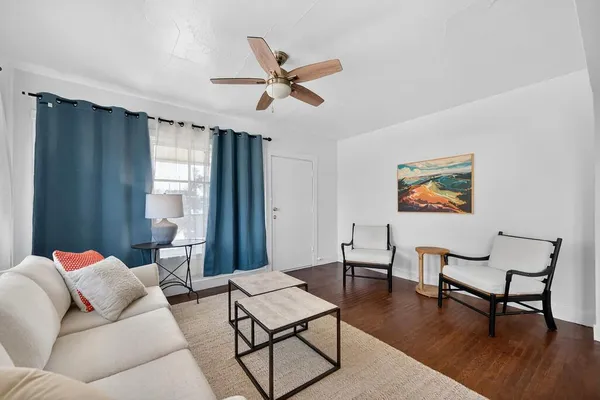 a living room with furniture and a window