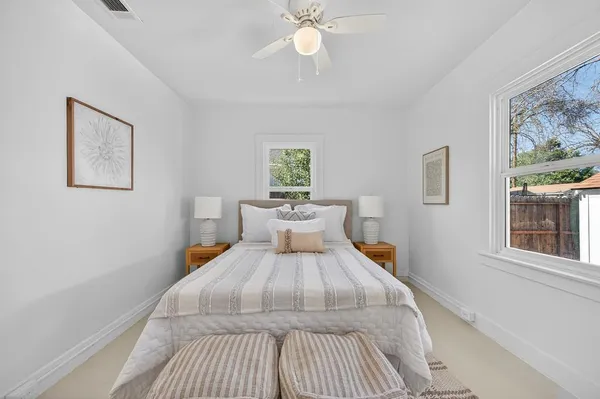 a bed room with a bed and a chandelier