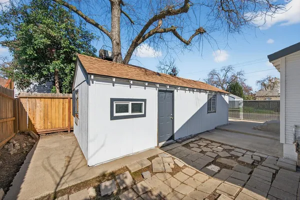 a backyard of a house with wooden floor