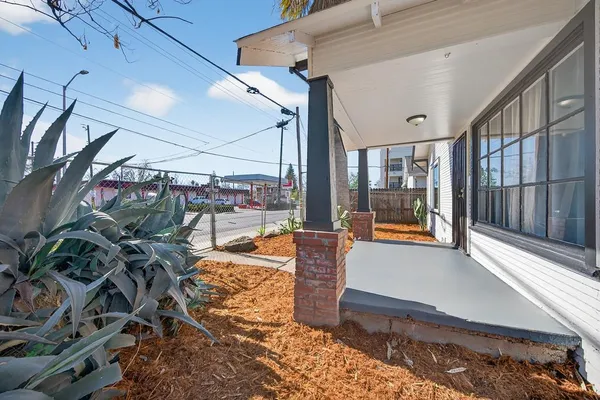 a lobby with furniture and floor to ceiling window