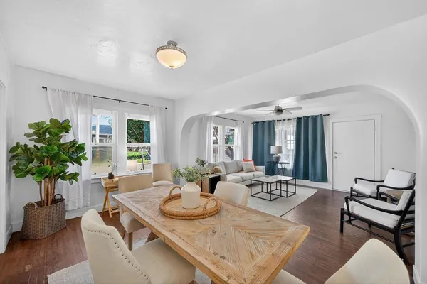 a view of a dining room with furniture window and wooden floor