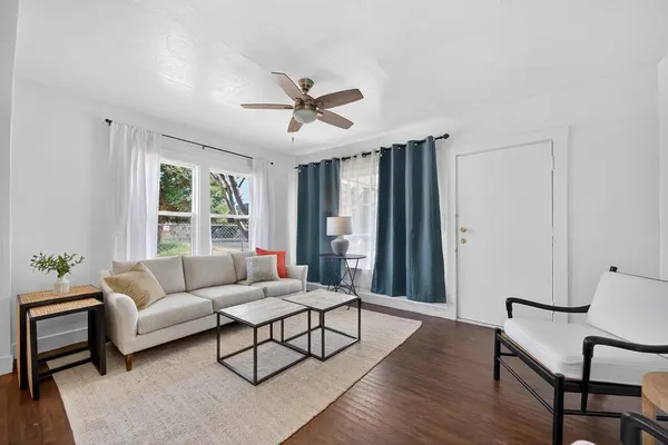 a living room with furniture and a window