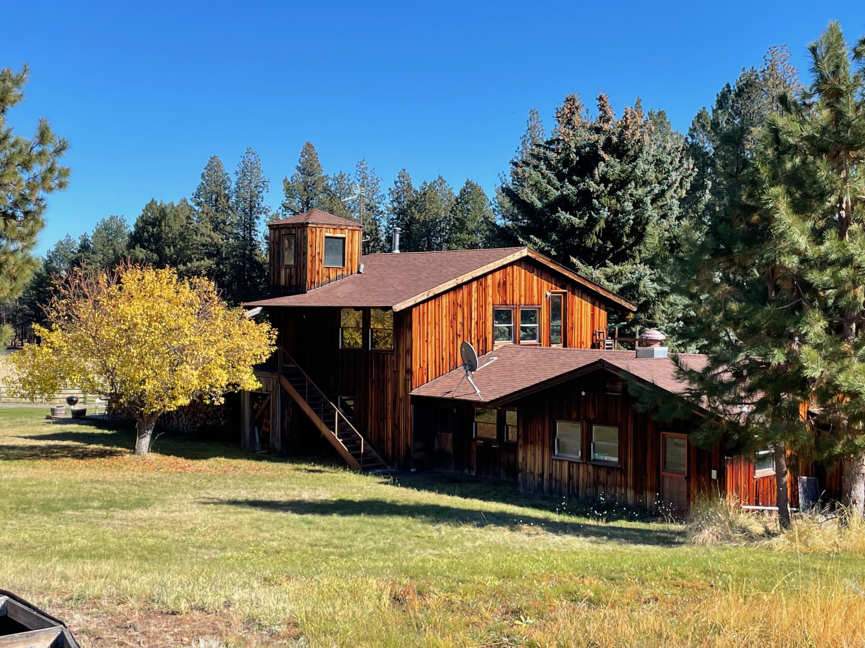 67500 Three Creek Road Sisters, OR 97759 - Photo 6 of 40 a front view of a house with a yard