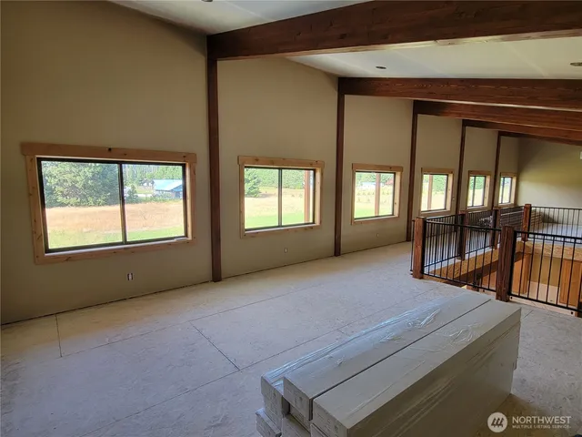 a view of an empty room with windows