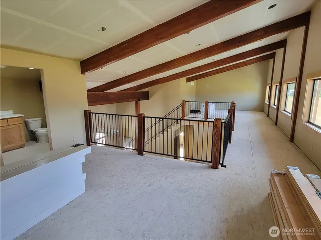 a view of a hallway with staircase