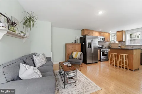 a living room with furniture and a rug