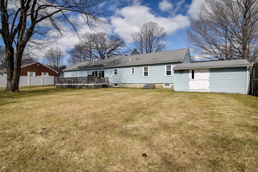 8 Edwards Road Natick, MA 01760 - Photo 20 of 29 a white house that has a tree in front of it