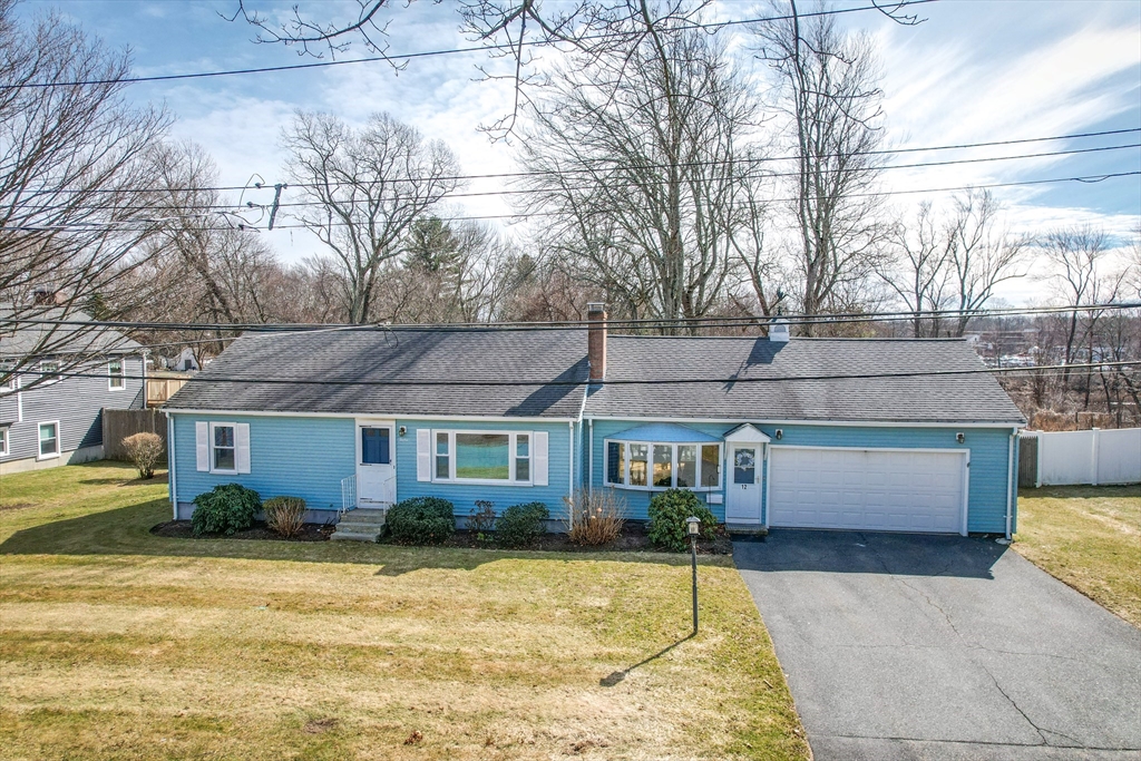 8 Edwards Road Natick, MA 01760 - Photo 21 of 29 a front view of a house with a yard and garage