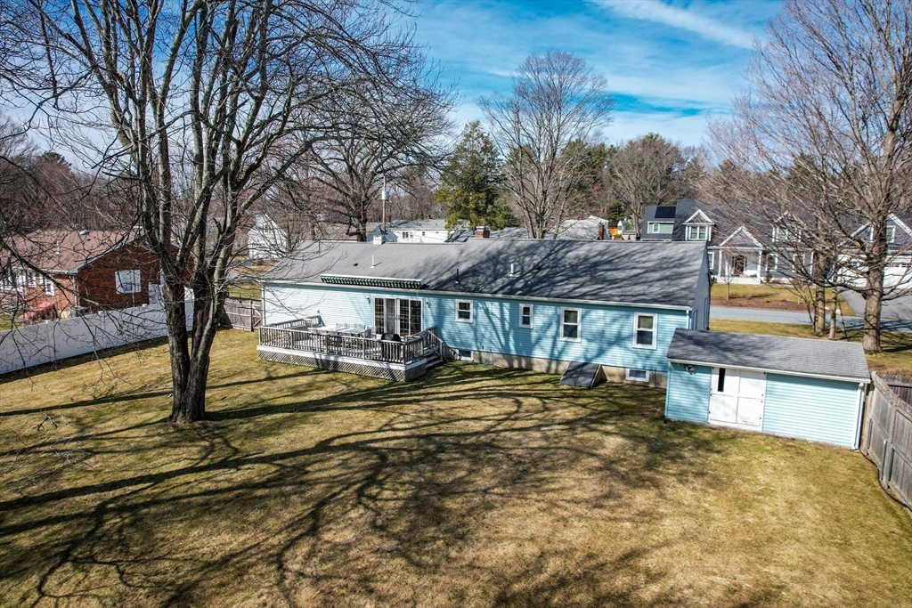8 Edwards Road Natick, MA 01760 - Photo 28 of 29 a view of a house with a yard and sitting area