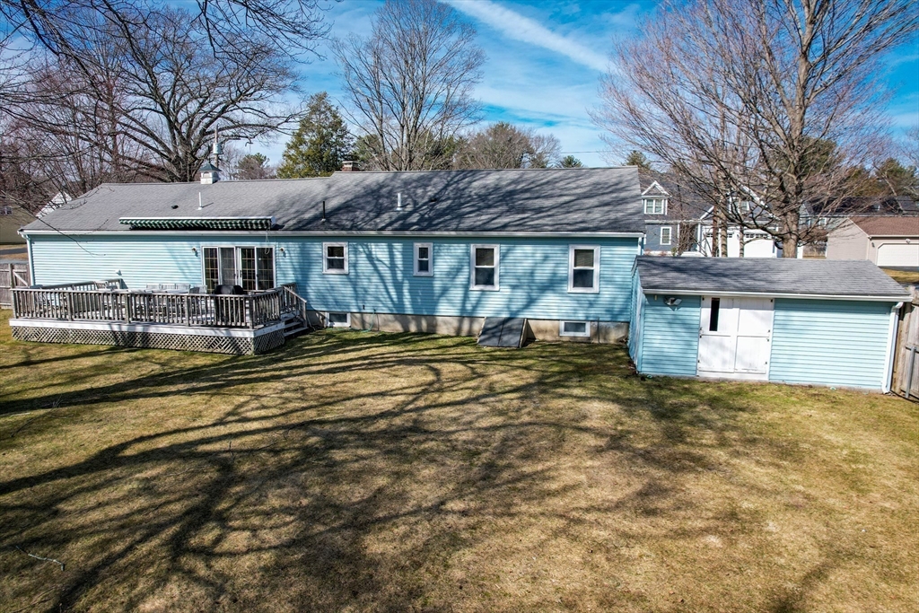 8 Edwards Road Natick, MA 01760 - Photo 29 of 29 a front view of house with yard and trees in the background