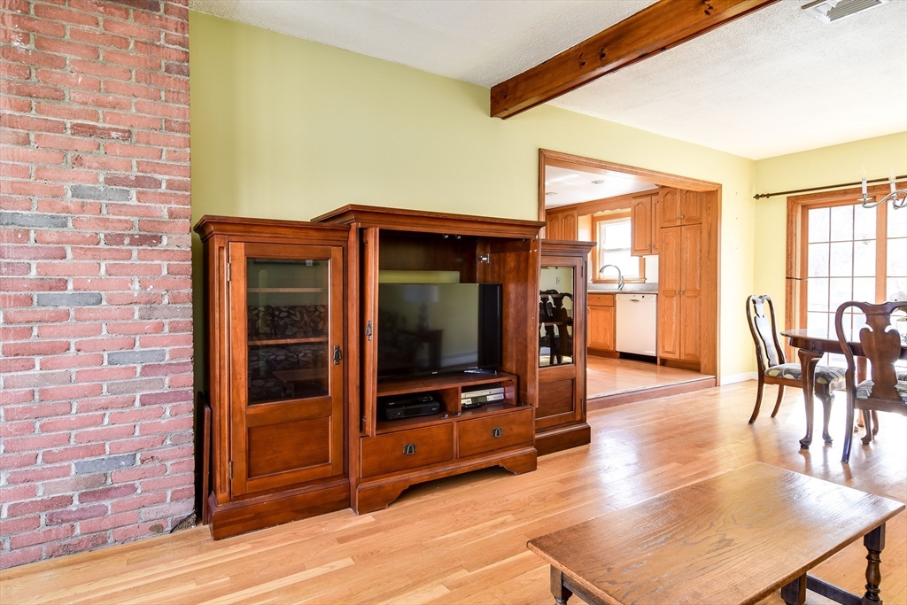 8 Edwards Road Natick, MA 01760 - Photo 3 of 29 a view of living room kitchen with furniture and wooden floor
