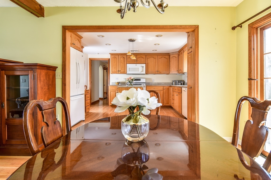 8 Edwards Road Natick, MA 01760 - Photo 5 of 29 a living room with furniture and a chandelier