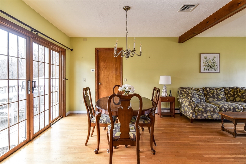 8 Edwards Road Natick, MA 01760 - Photo 7 of 29 a view of a dining room with furniture window and wooden floor