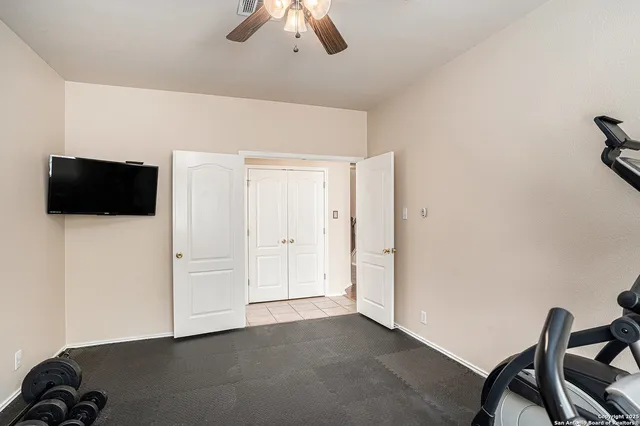 a view of a livingroom with an empty space and a chair