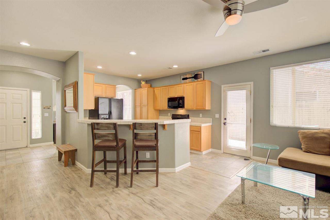 10482 Gold Trail Drive Reno, NV 89521 - Photo 11 of 40 a living room with furniture and kitchen view