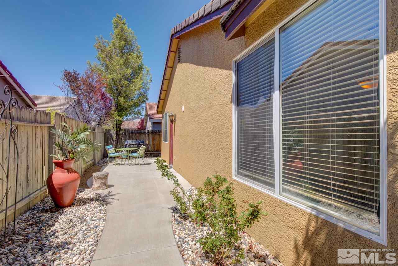 10482 Gold Trail Drive Reno, NV 89521 - Photo 29 of 40 a view of a backyard with plants and entertaining space