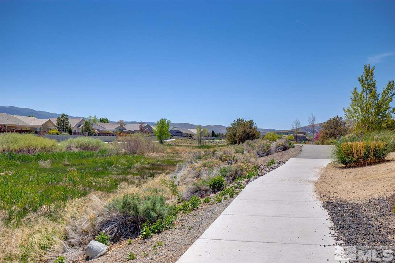 10482 Gold Trail Drive Reno, NV 89521 - Photo 32 of 40 a view of a pathway both side of grassy field with trees