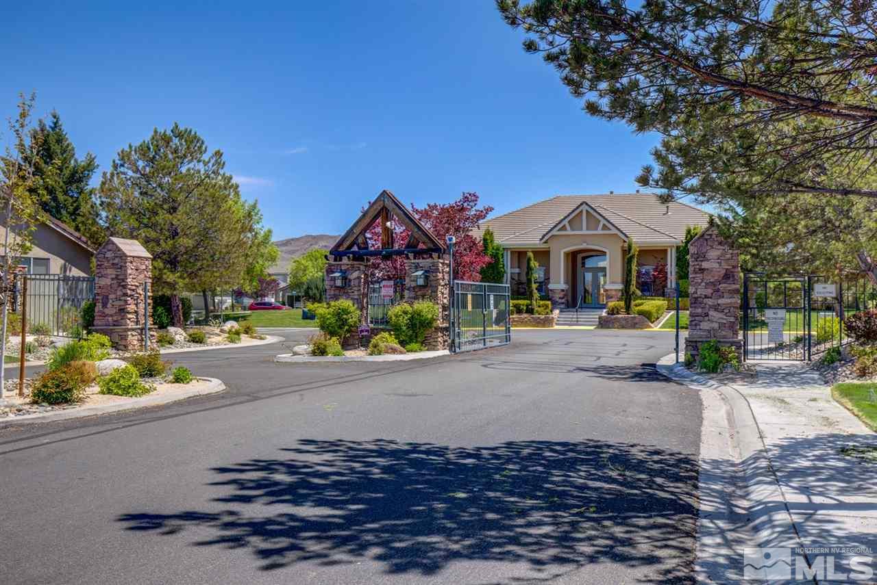 10482 Gold Trail Drive Reno, NV 89521 - Photo 36 of 40 a front view of a house with a yard and a garage