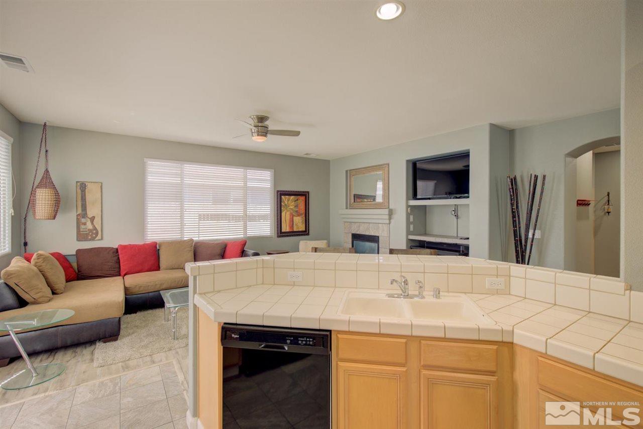 10482 Gold Trail Drive Reno, NV 89521 - Photo 8 of 40 a living room with furniture and a flat screen tv