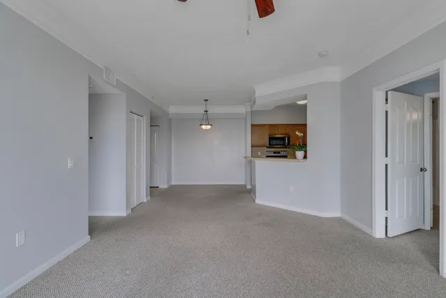a kitchen with a refrigerator a stove top oven a sink and dishwasher