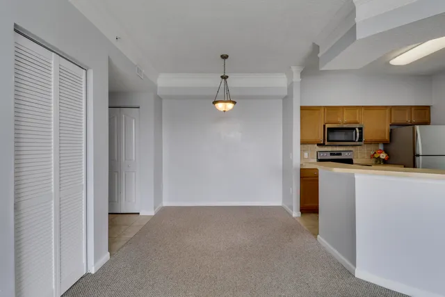 a bathroom with a sink a toilet a mirror and vanity