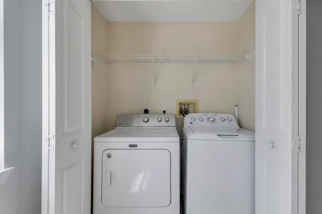a view of a house with a small yard and plants