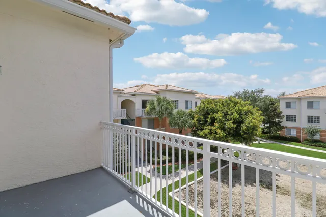a living room with furniture gym equipment and a large window