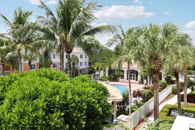 a view of a house with backyard porch and sitting area