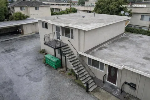 a view of a terrace with a table and chairs