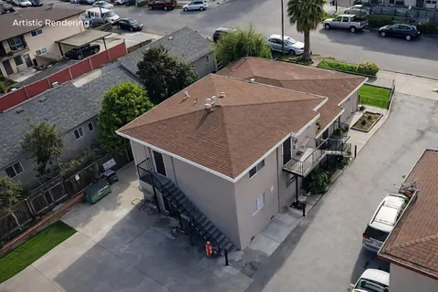 an aerial view of a house with table and chairs