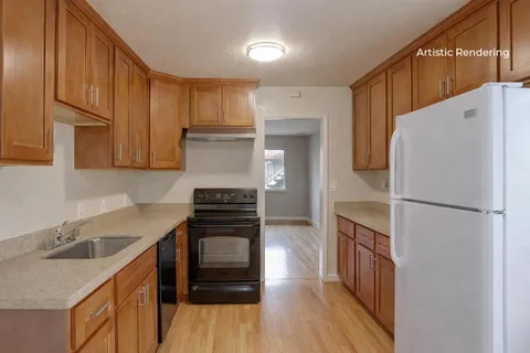 a kitchen with a refrigerator sink and stove