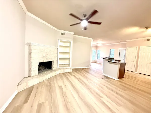 a view of a kitchen with microwave and stove top oven
