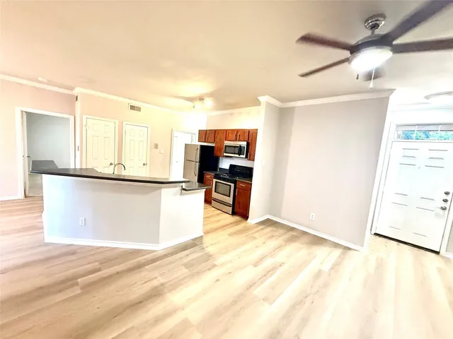 a view of a kitchen with a sink
