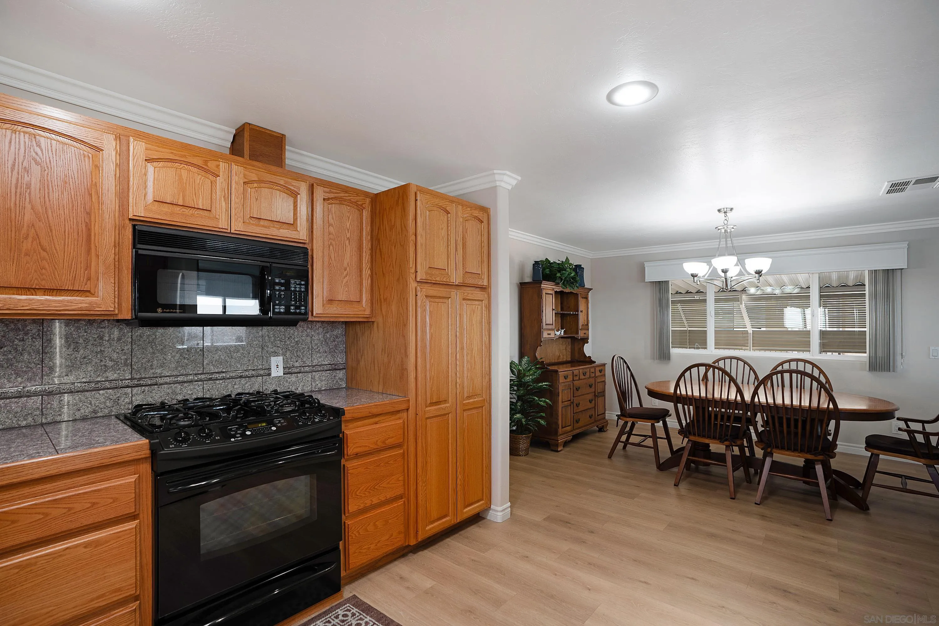 9500 Harritt Road, Unit 234 Lakeside, CA 92040 - Photo 11 of 29 a kitchen with stainless steel appliances granite countertop a stove and a refrigerator