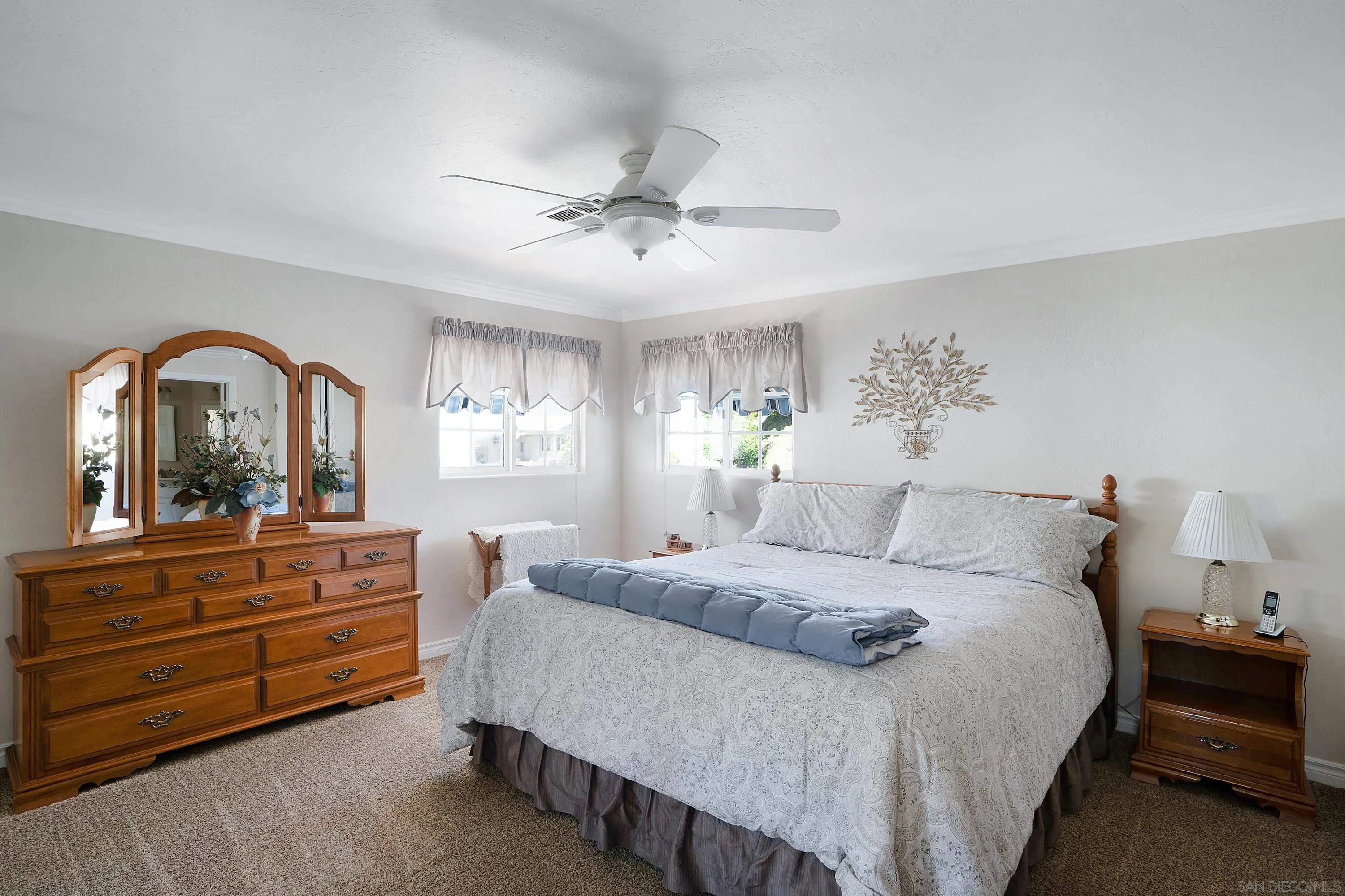 9500 Harritt Road, Unit 234 Lakeside, CA 92040 - Photo 16 of 29 a bedroom with a bed and a dresser