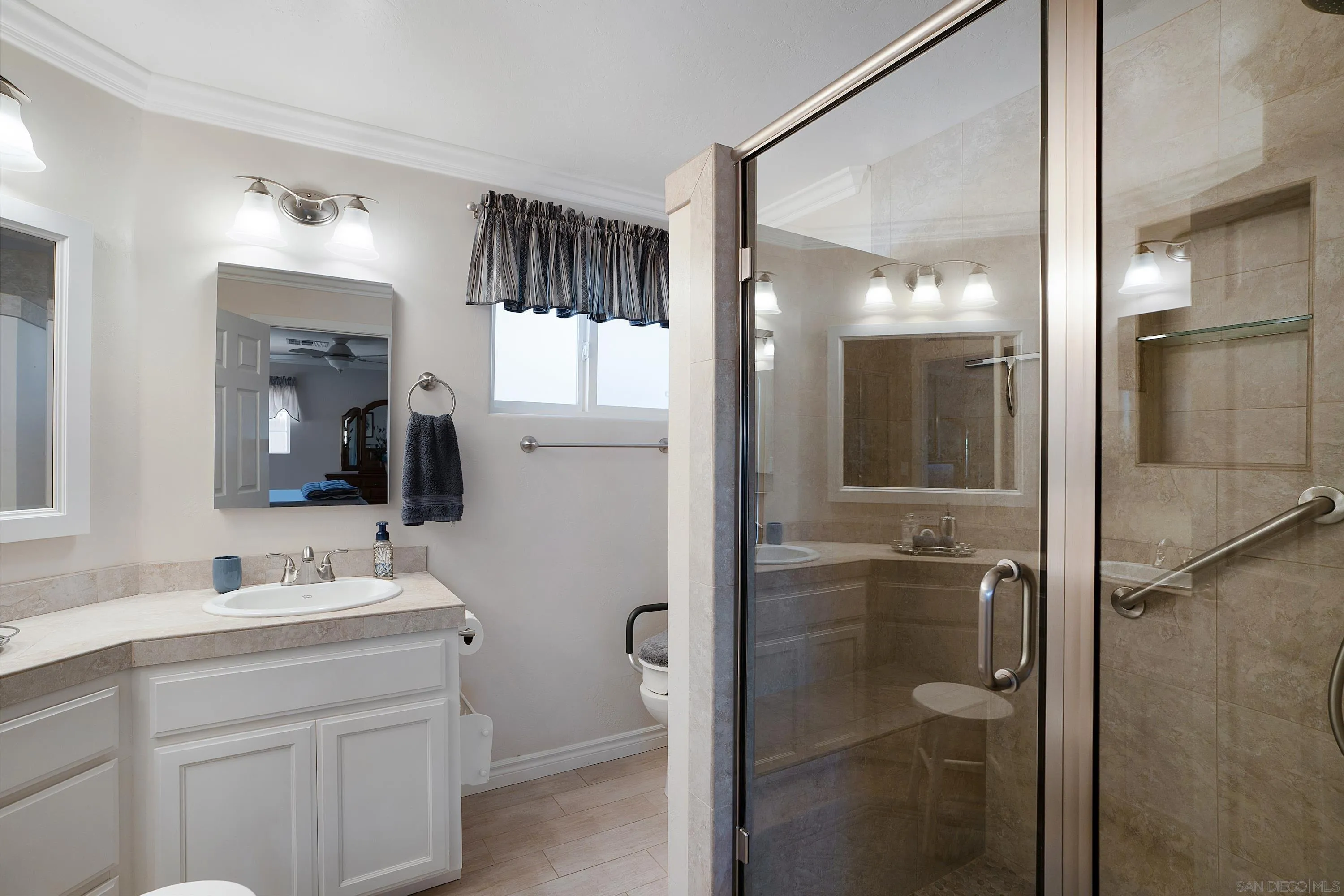 9500 Harritt Road, Unit 234 Lakeside, CA 92040 - Photo 18 of 29 a bathroom with a sink vanity and a mirror
