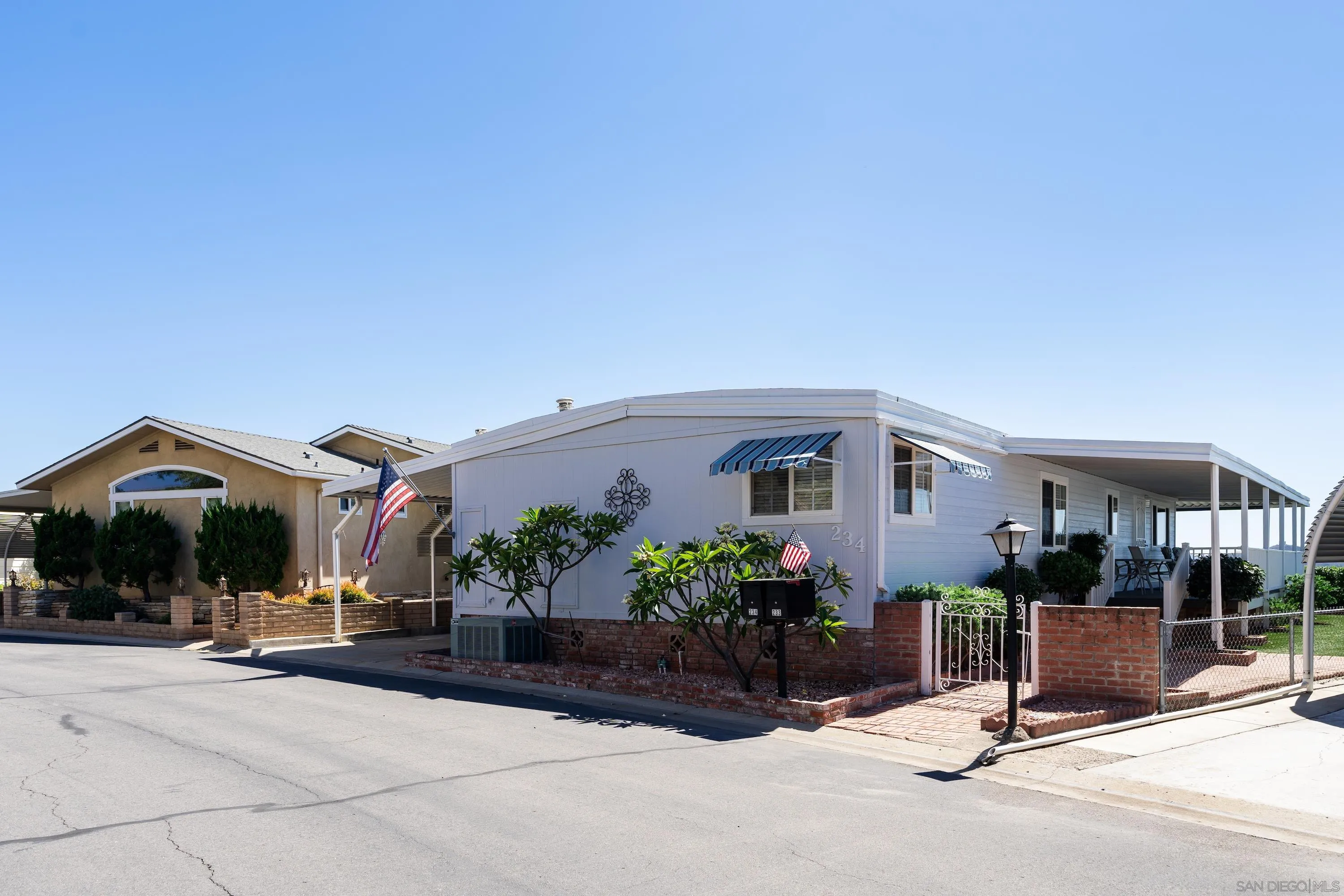 9500 Harritt Road, Unit 234 Lakeside, CA 92040 - Photo 19 of 29 a view of a house with sitting area and potted plants