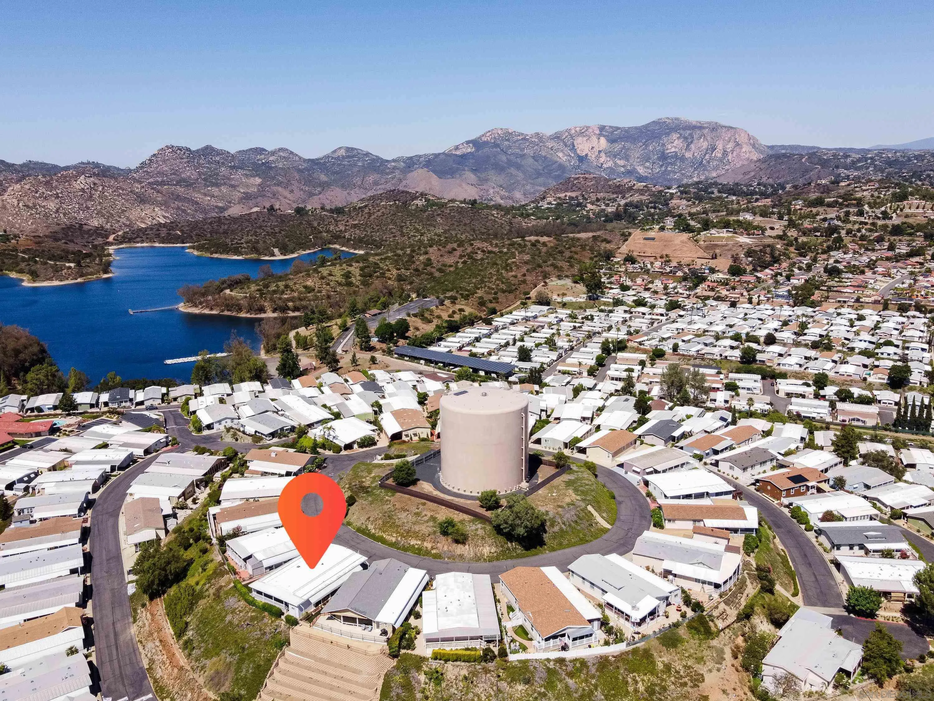9500 Harritt Road, Unit 234 Lakeside, CA 92040 - Photo 23 of 29 a view of a terrace with a table and chairs under an umbrella