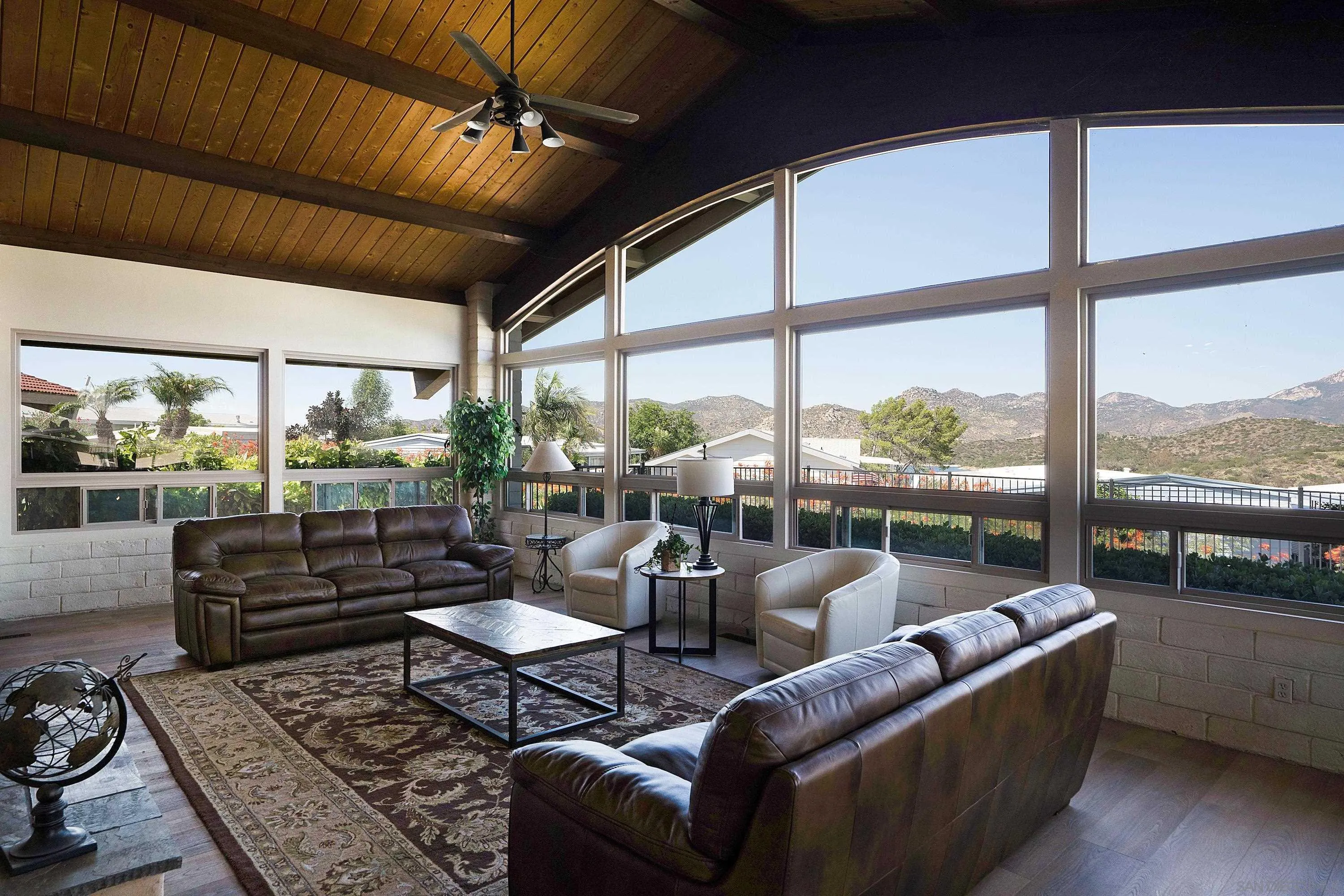 9500 Harritt Road, Unit 234 Lakeside, CA 92040 - Photo 27 of 29 a living room with furniture tv and a large window