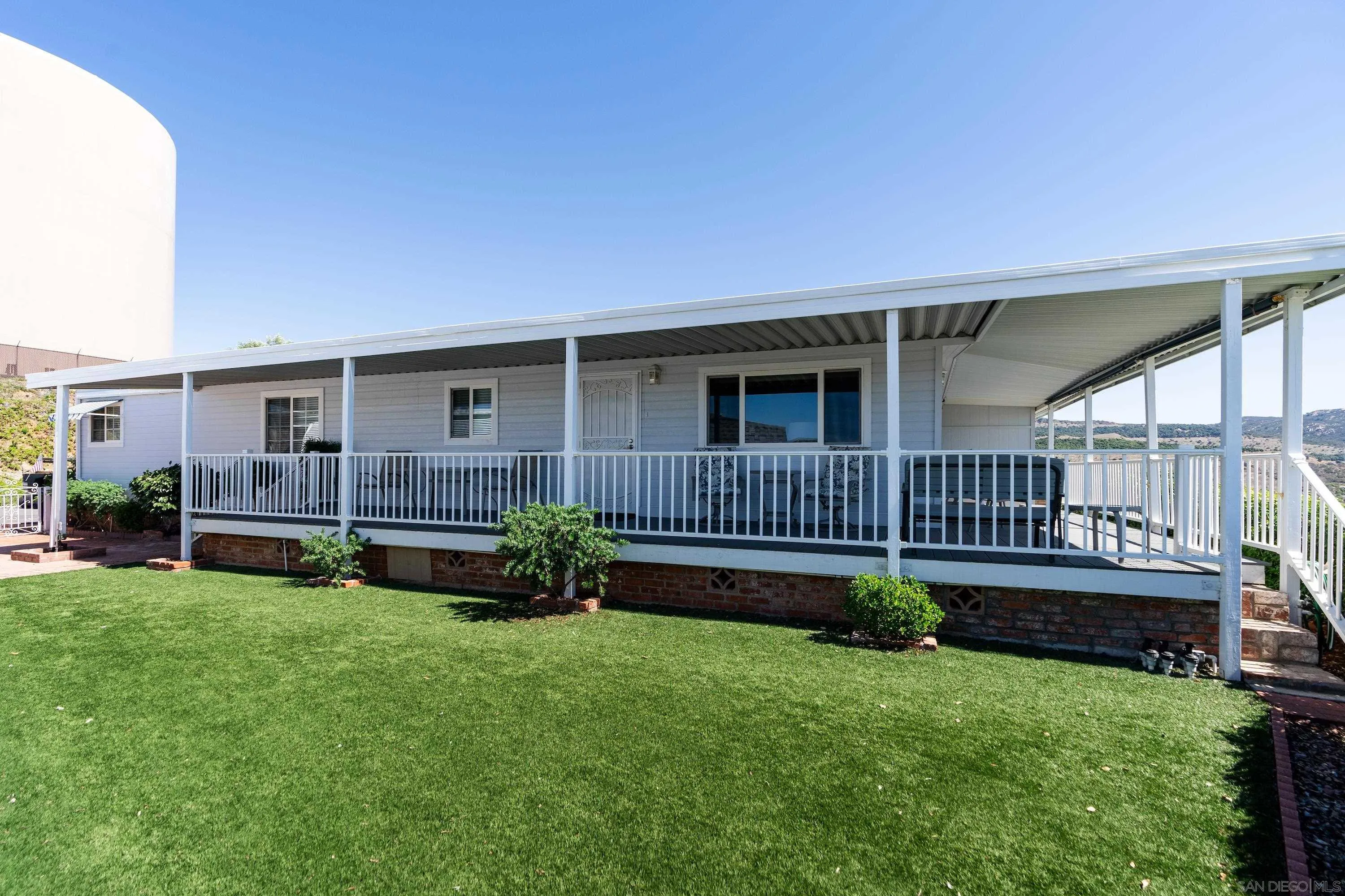 9500 Harritt Road, Unit 234 Lakeside, CA 92040 - Photo 3 of 29 a front view of a house with garden