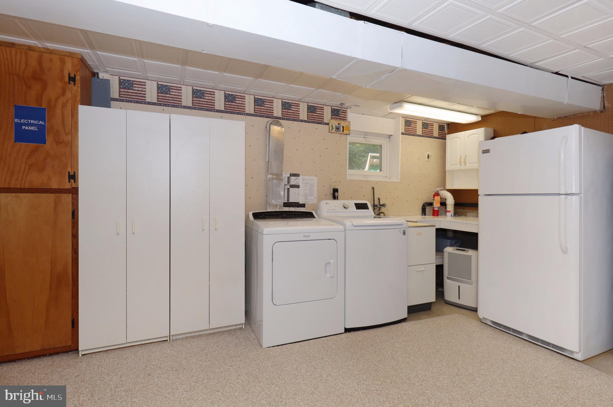 6706 Red Jacket Road Springfield, VA 22152 - Photo 39 of 48 Laundry Area with Deep Sink and Extra Fridge