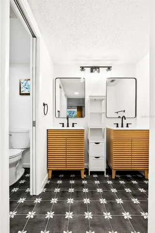 a bathroom with a toilet a sink and a shower