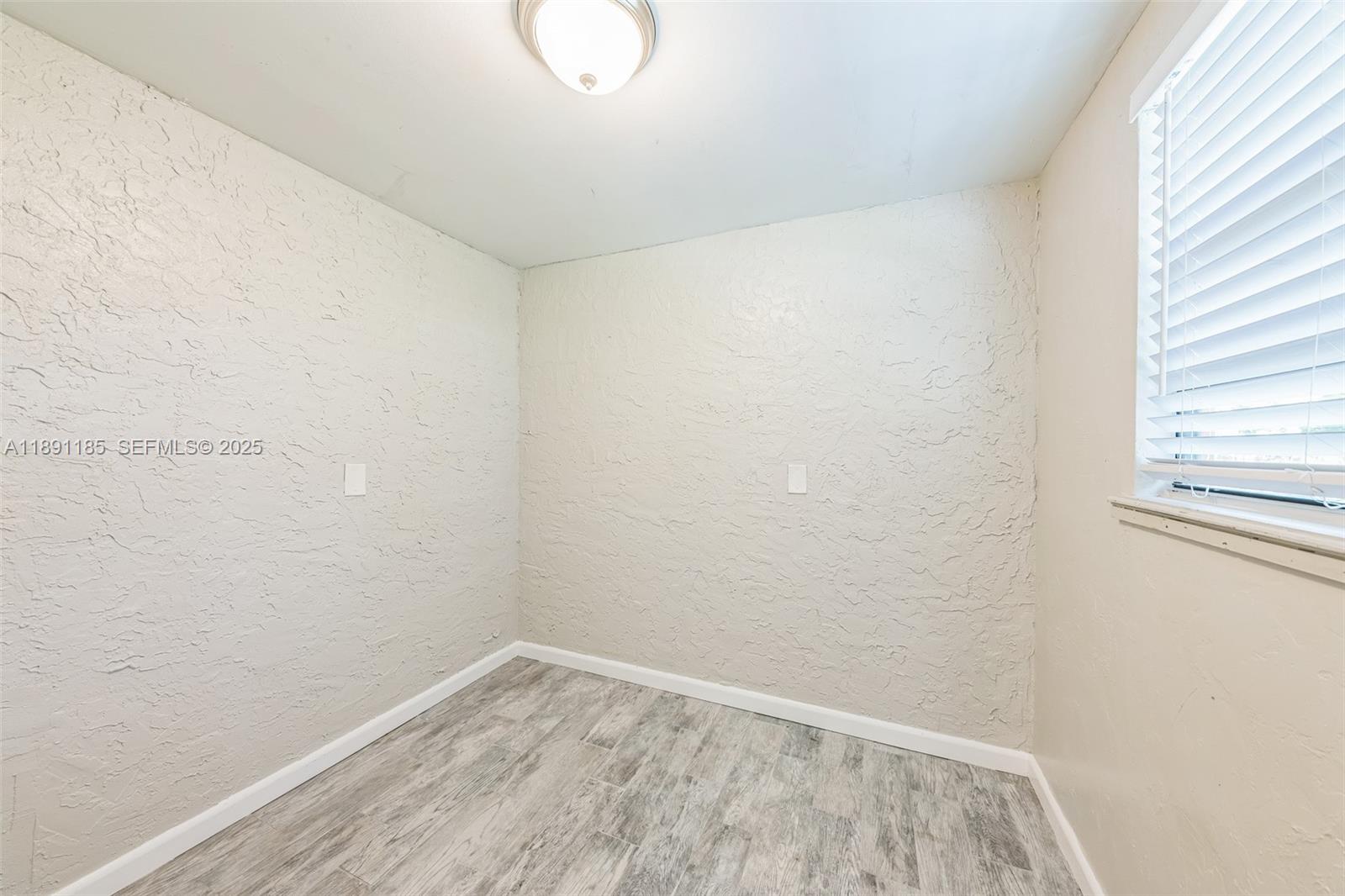 10108 Windtree Lane Boca Raton, FL 33428 - Photo 11 of 15 a view of small space with empty racks