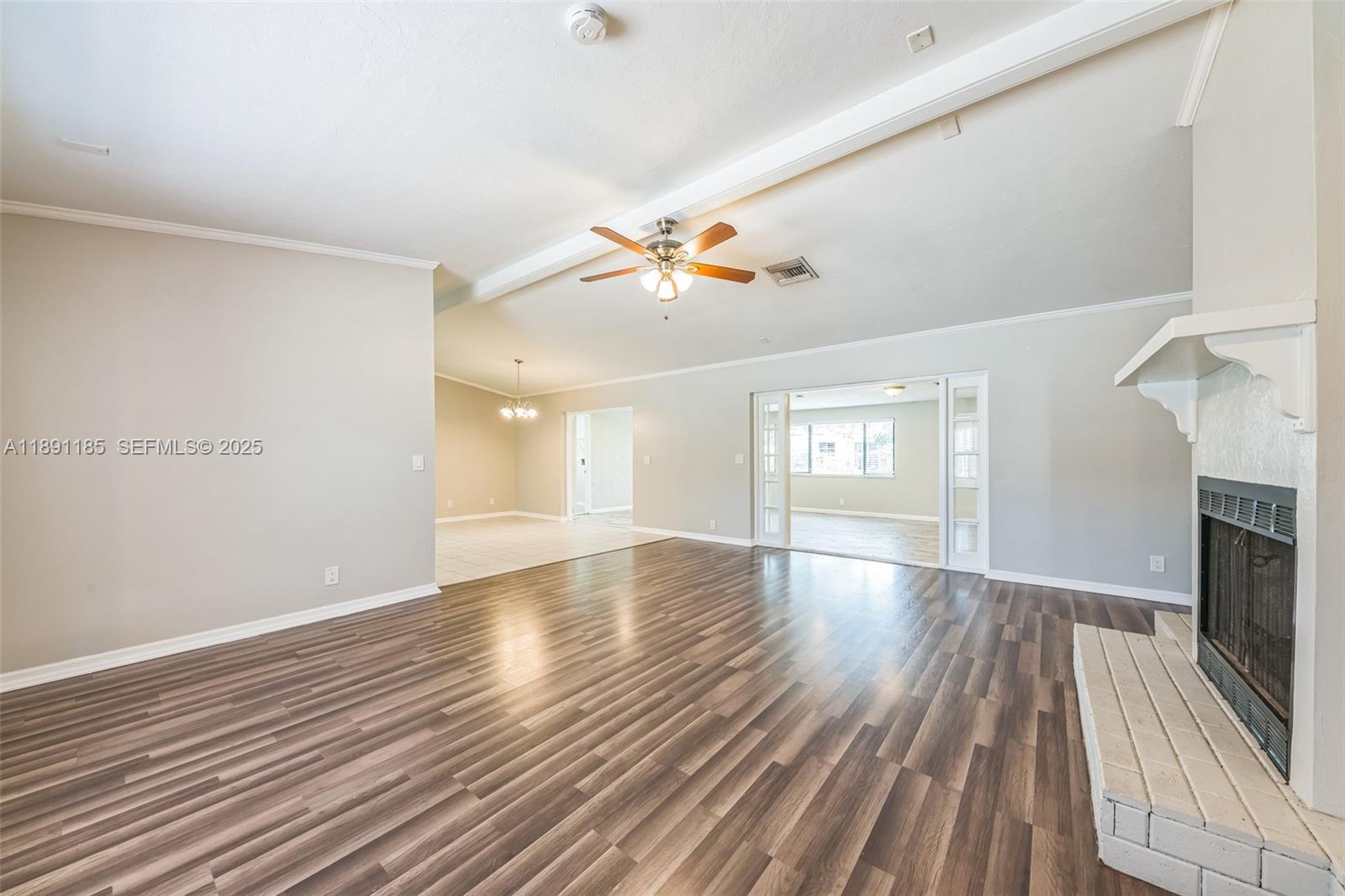 10108 Windtree Lane Boca Raton, FL 33428 - Photo 10 of 15 wooden floor in an empty room with a window